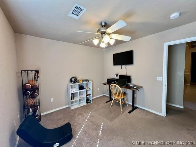 carpeted home office with ceiling fan, visible vents, and baseboards