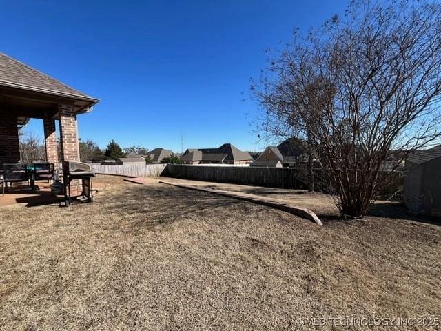 view of yard with fence