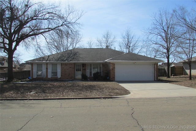 single story home with driveway, a garage, fence, and brick siding