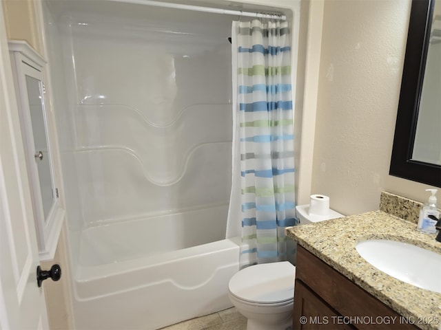 bathroom with a textured wall, shower / tub combo, vanity, and toilet