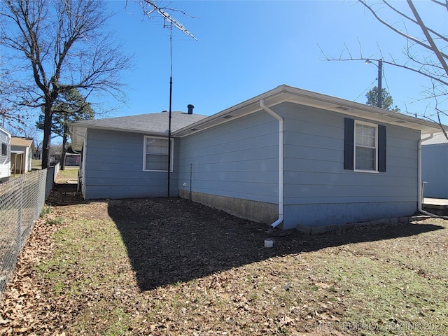 back of property with fence