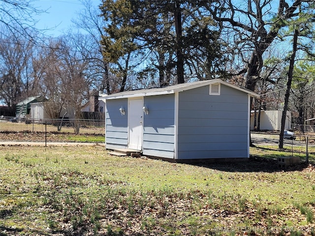view of shed with fence