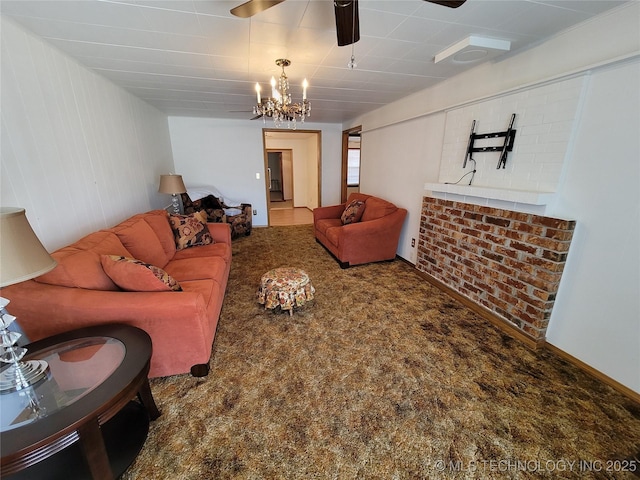 living area featuring carpet flooring and ceiling fan with notable chandelier
