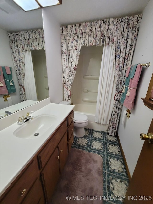 full bath with shower / tub combo, vanity, and toilet