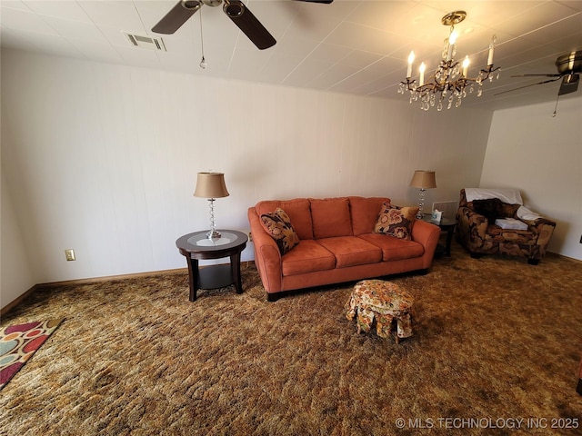 living room with ceiling fan with notable chandelier, carpet, and visible vents