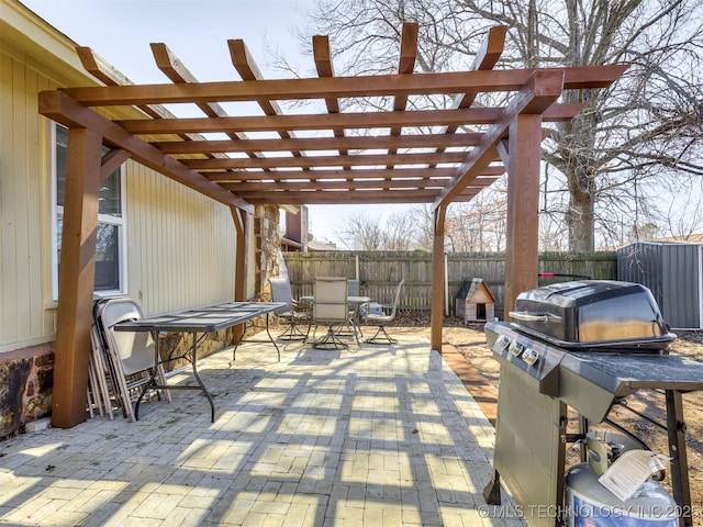 view of patio featuring outdoor dining area, a fenced backyard, area for grilling, and a pergola