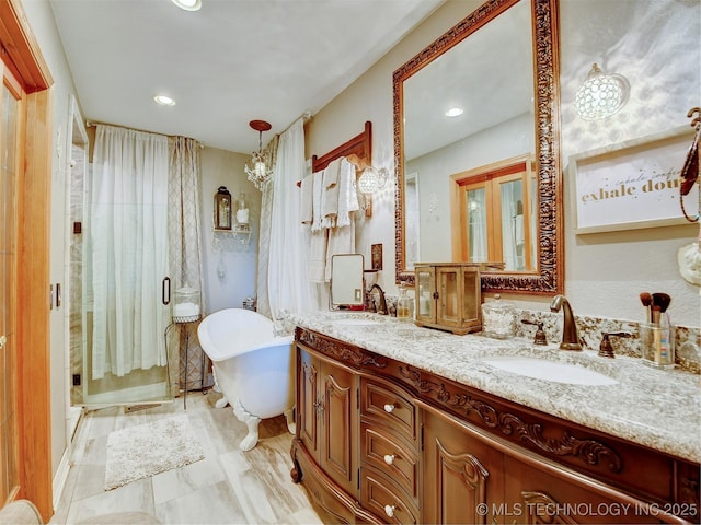 full bathroom featuring double vanity, recessed lighting, a soaking tub, a stall shower, and a sink