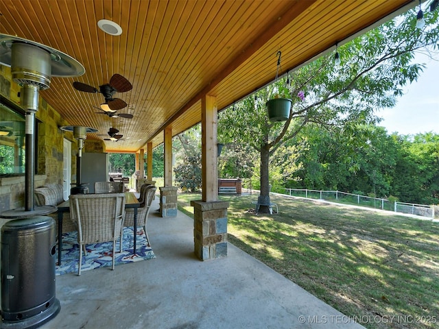 view of patio with a ceiling fan, a fenced backyard, and an outdoor hangout area