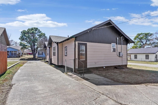 view of property exterior featuring fence