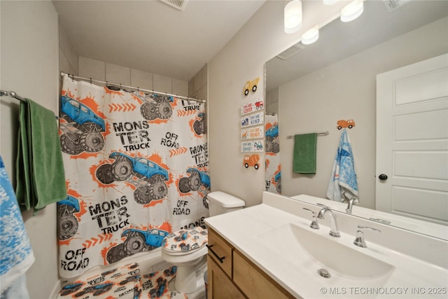 bathroom featuring visible vents, a shower with shower curtain, vanity, and toilet