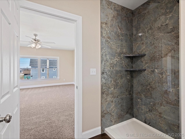 400 S Chickasaw Ave, Bartlesville, OK 74003 - bathroom with a tile shower, ceiling fan, and baseboards