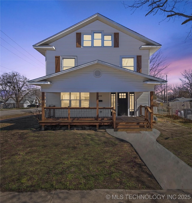 view of front of house featuring a porch and a front yard