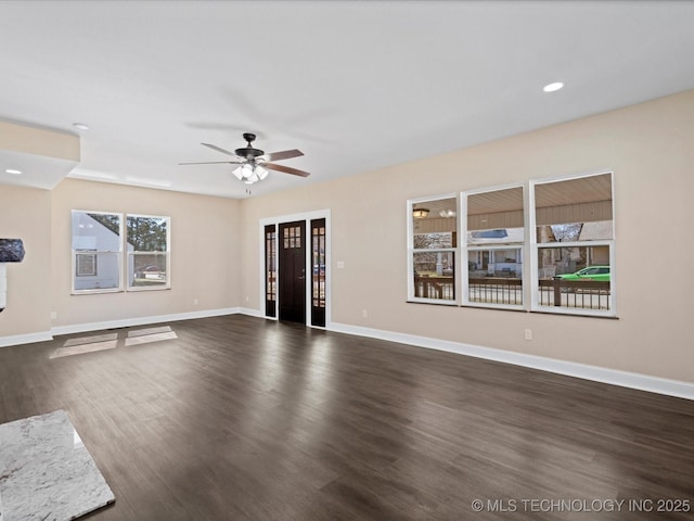 unfurnished living room featuring dark wood-style floors, recessed lighting, ceiling fan, and baseboards