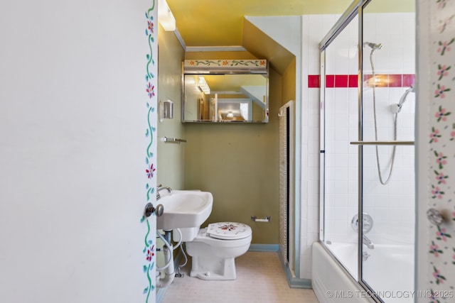 full bathroom with toilet, shower / bath combination with glass door, baseboards, and ornamental molding