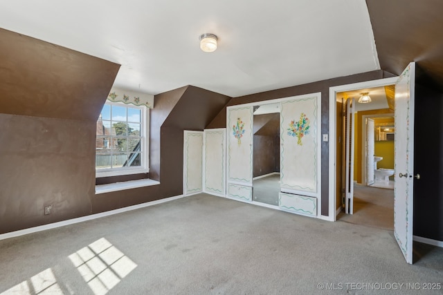 bonus room featuring carpet floors, vaulted ceiling, and baseboards