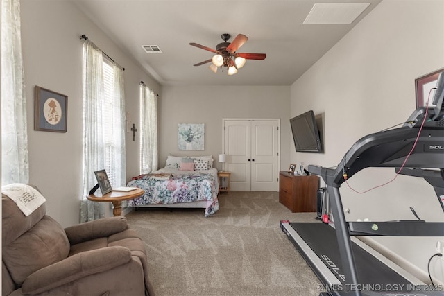 bedroom with carpet floors, visible vents, and a ceiling fan