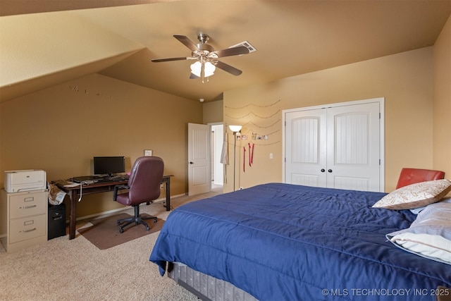 bedroom with baseboards, lofted ceiling, ceiling fan, carpet floors, and a closet