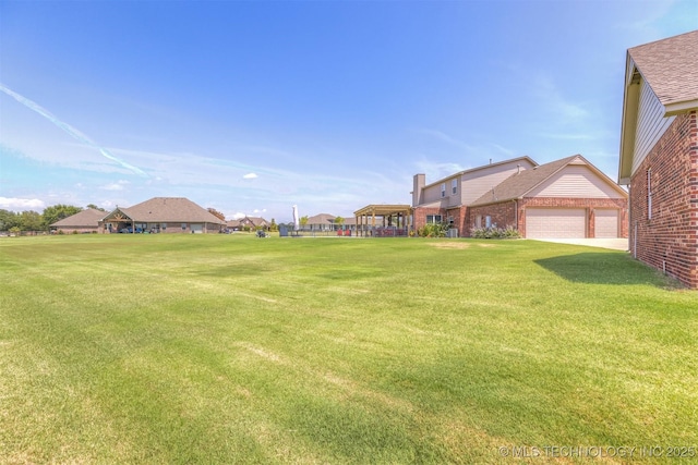 view of yard with an attached garage