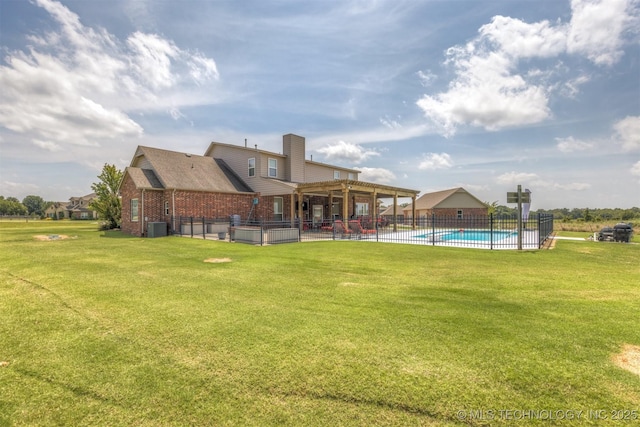 rear view of house with a fenced in pool, brick siding, a patio, a lawn, and cooling unit