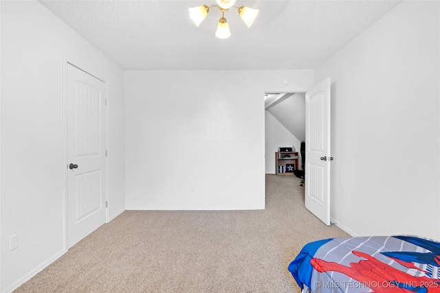 carpeted bedroom with a textured ceiling