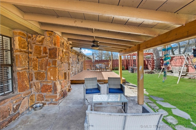 view of patio with a fenced backyard, outdoor dining area, a ceiling fan, and a wooden deck