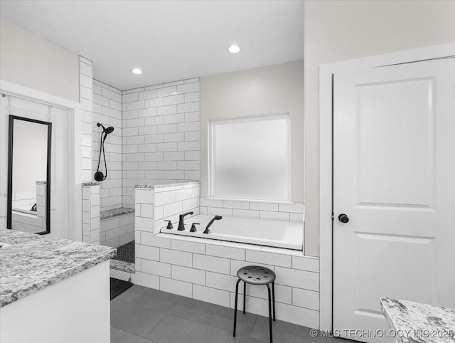 full bathroom with a garden tub, recessed lighting, vanity, walk in shower, and tile patterned floors