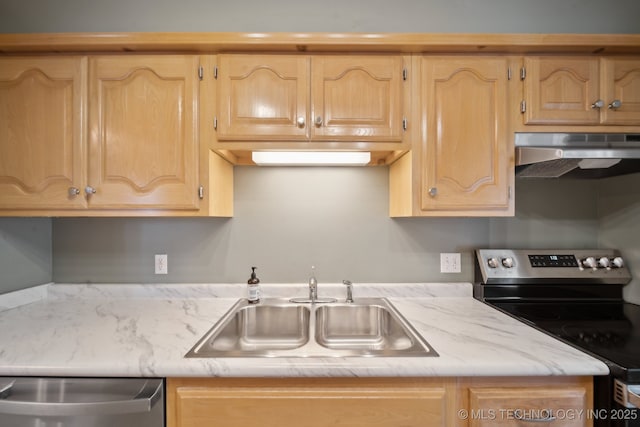 kitchen featuring under cabinet range hood, appliances with stainless steel finishes, light brown cabinetry, and a sink