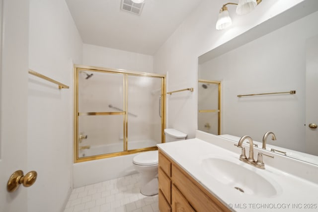 full bath with visible vents, bath / shower combo with glass door, toilet, tile patterned floors, and vanity