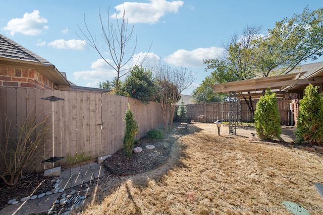 view of yard with a fenced backyard