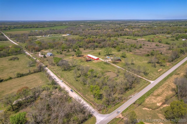 birds eye view of property featuring a rural view