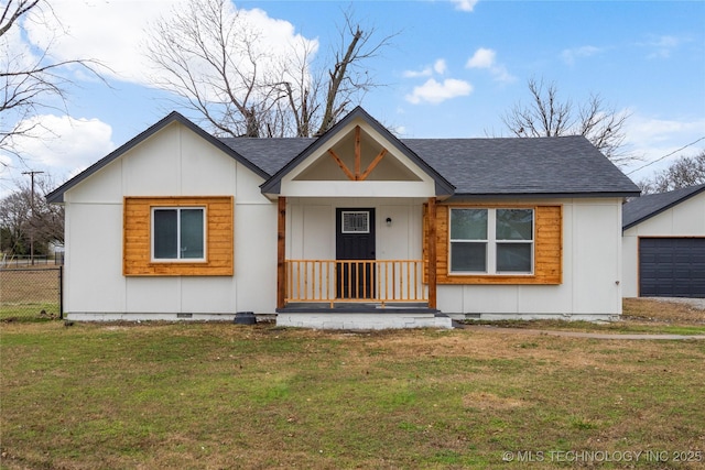 view of front facade with an outbuilding, a shingled roof, fence, crawl space, and a front yard