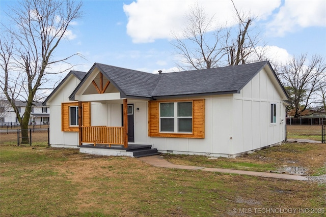 modern farmhouse style home with a shingled roof, crawl space, fence, board and batten siding, and a front yard