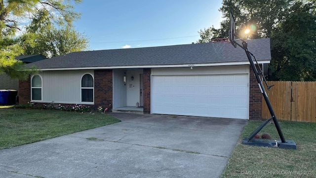 ranch-style home with brick siding, concrete driveway, an attached garage, fence, and a front lawn