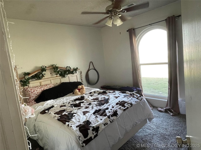 bedroom with ceiling fan, carpet flooring, and visible vents