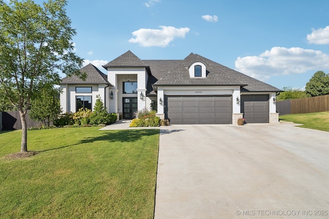 view of front of house featuring a garage, fence, concrete driveway, and a front yard