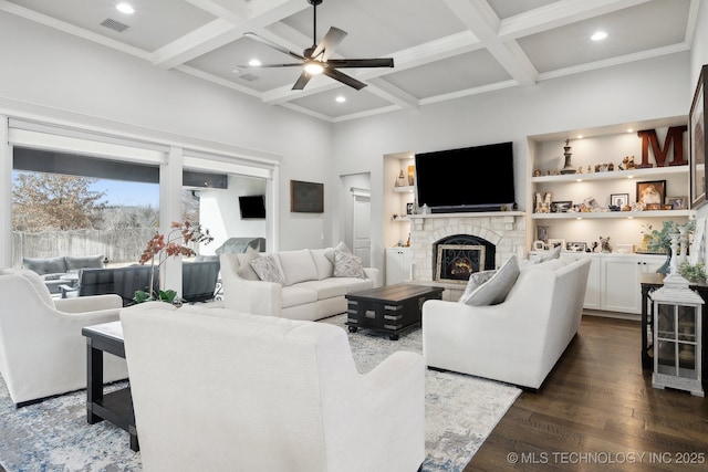 living area with dark wood-type flooring, coffered ceiling, a fireplace, and beam ceiling