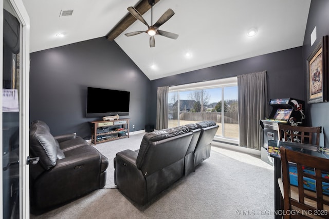 home theater featuring lofted ceiling with beams, ceiling fan, visible vents, baseboards, and carpet