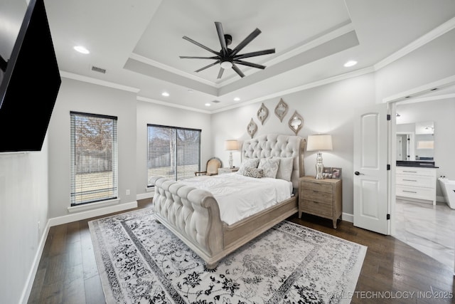 bedroom featuring baseboards, visible vents, a raised ceiling, and dark wood finished floors