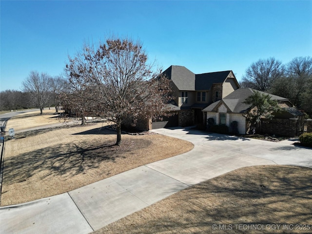 view of front of property featuring driveway and an attached garage