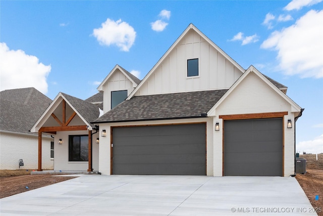 modern farmhouse with board and batten siding, roof with shingles, and a garage