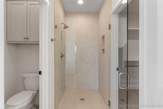 full bath with toilet, a stall shower, and recessed lighting