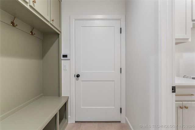 mudroom with light tile patterned floors