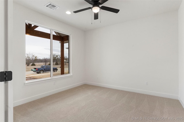 carpeted spare room with ceiling fan, recessed lighting, visible vents, and baseboards