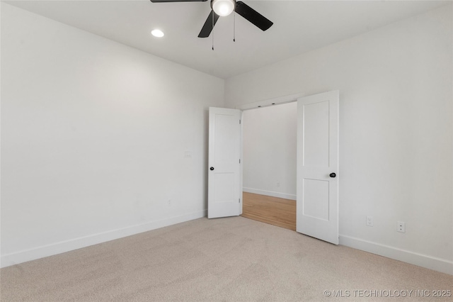 empty room with a ceiling fan, carpet, baseboards, and recessed lighting