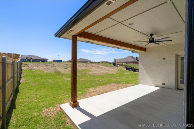 view of patio featuring fence, visible vents, and a ceiling fan