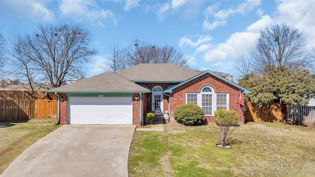 ranch-style house with fence, a front lawn, concrete driveway, and brick siding