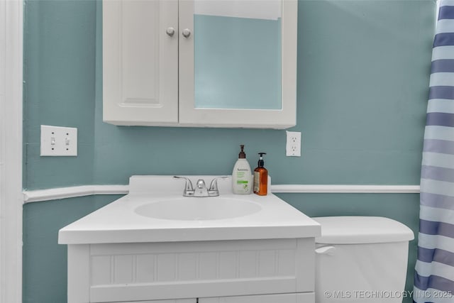 2517 Westwood, Ardmore, OK 73401 - full bath with vanity, toilet, and a shower with shower curtain