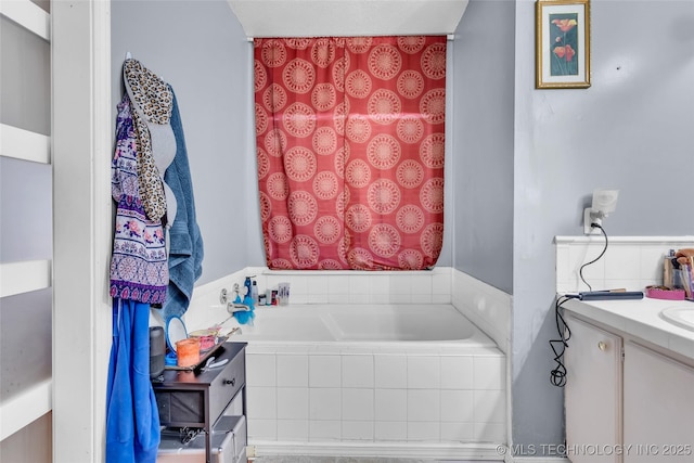 full bath with a garden tub and vanity