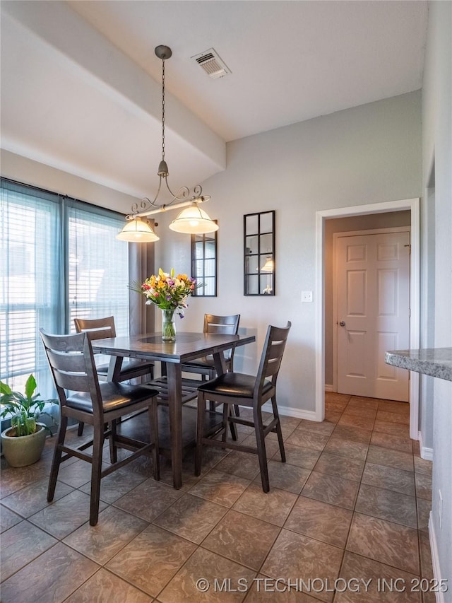 dining space featuring baseboards and visible vents