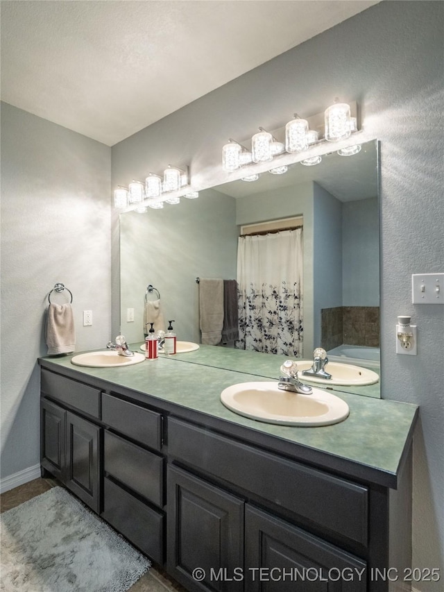 bathroom with double vanity and a sink